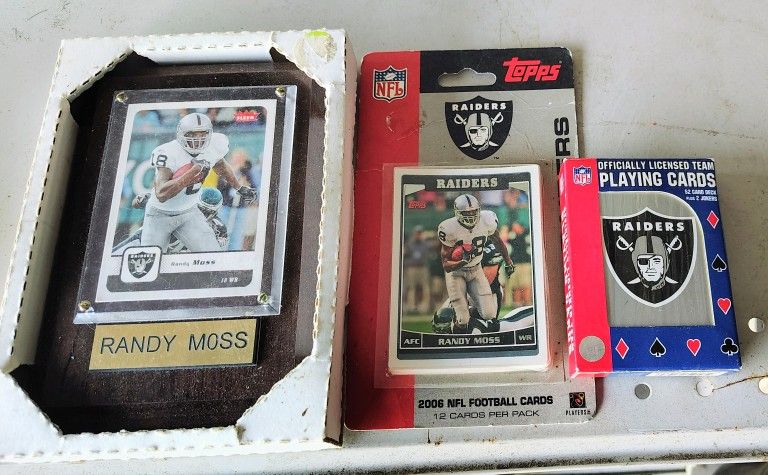 Raiders memorabilia, Framed Randy Moss card, unopened 2006 Topps trading cards & playing cards