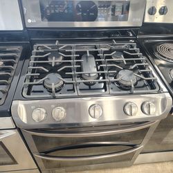 LG Stainless steel gas stove Double oven 5 burners  In Excellent Working Condition