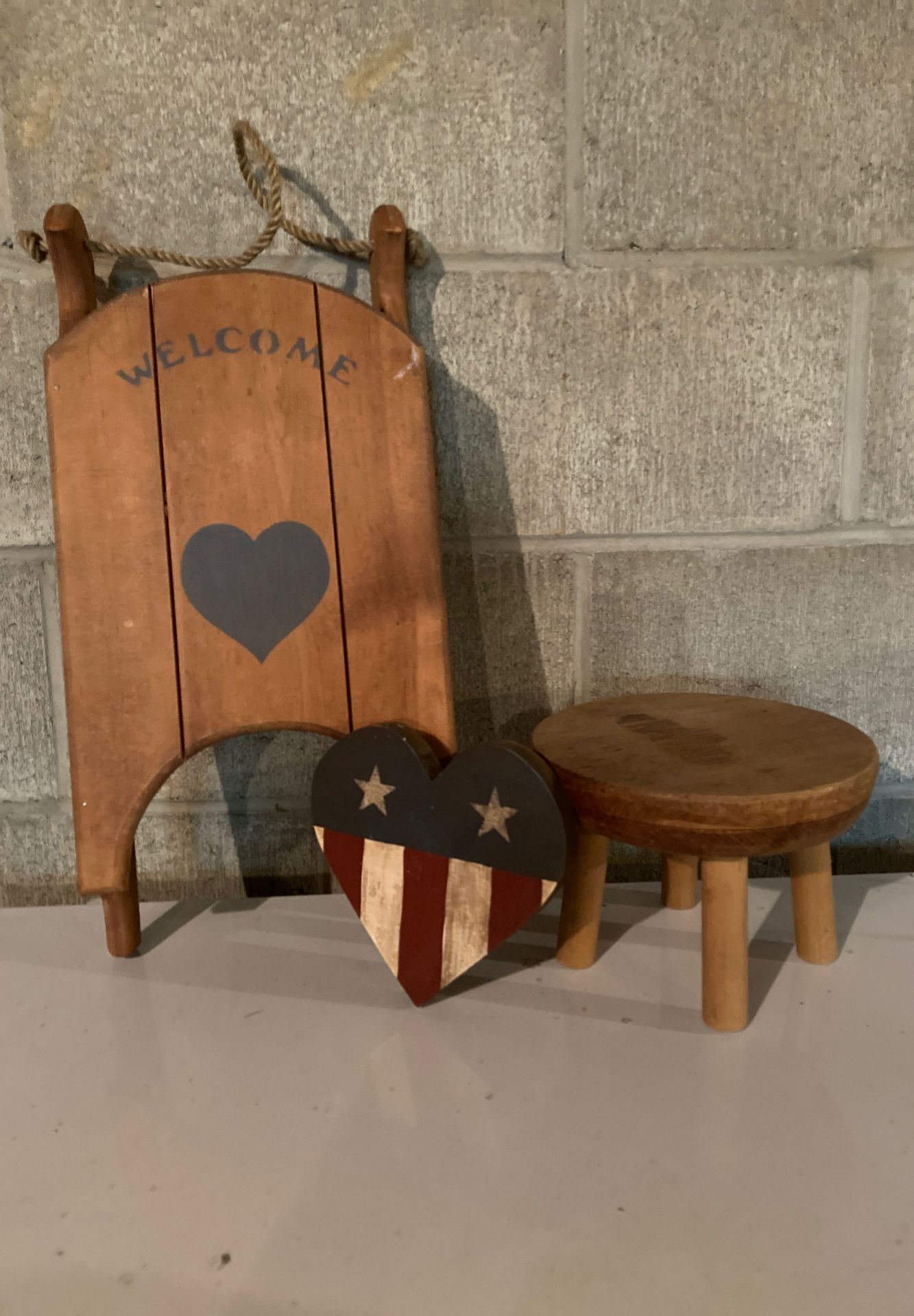 Wooden welcome sleigh with small wooden stool & wooden heart flag