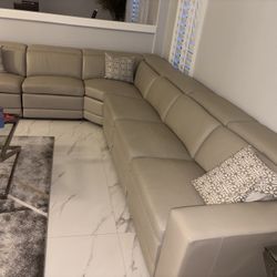 Beige leather sectional and armchair set