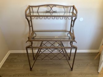 Dining room table w/ four matching chairs and matching wine rack.