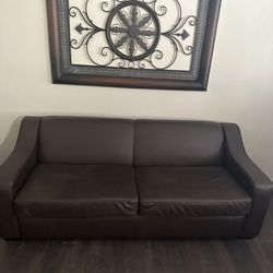 Leather Couch with pull out bed 