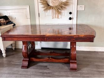 ornate wood-stained dining table