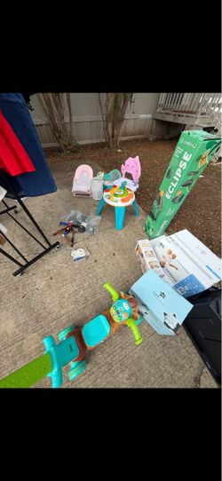 Baby clothes and toys and halloween decorations