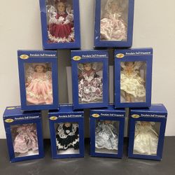 Special Times porcelain doll ornament collection.  Includes nine dolls new in box. 