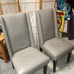 Two High Back Gray Leather Chairs With Cherry Wood Legs 19 Inches From Floor To Seat