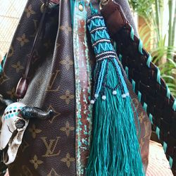 Lv Bag With Tassels  Natural Resource Department
