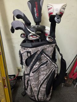 Taylor Made golf bag with Golf clubs.