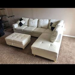 White Leather Sectional And Ottoman 