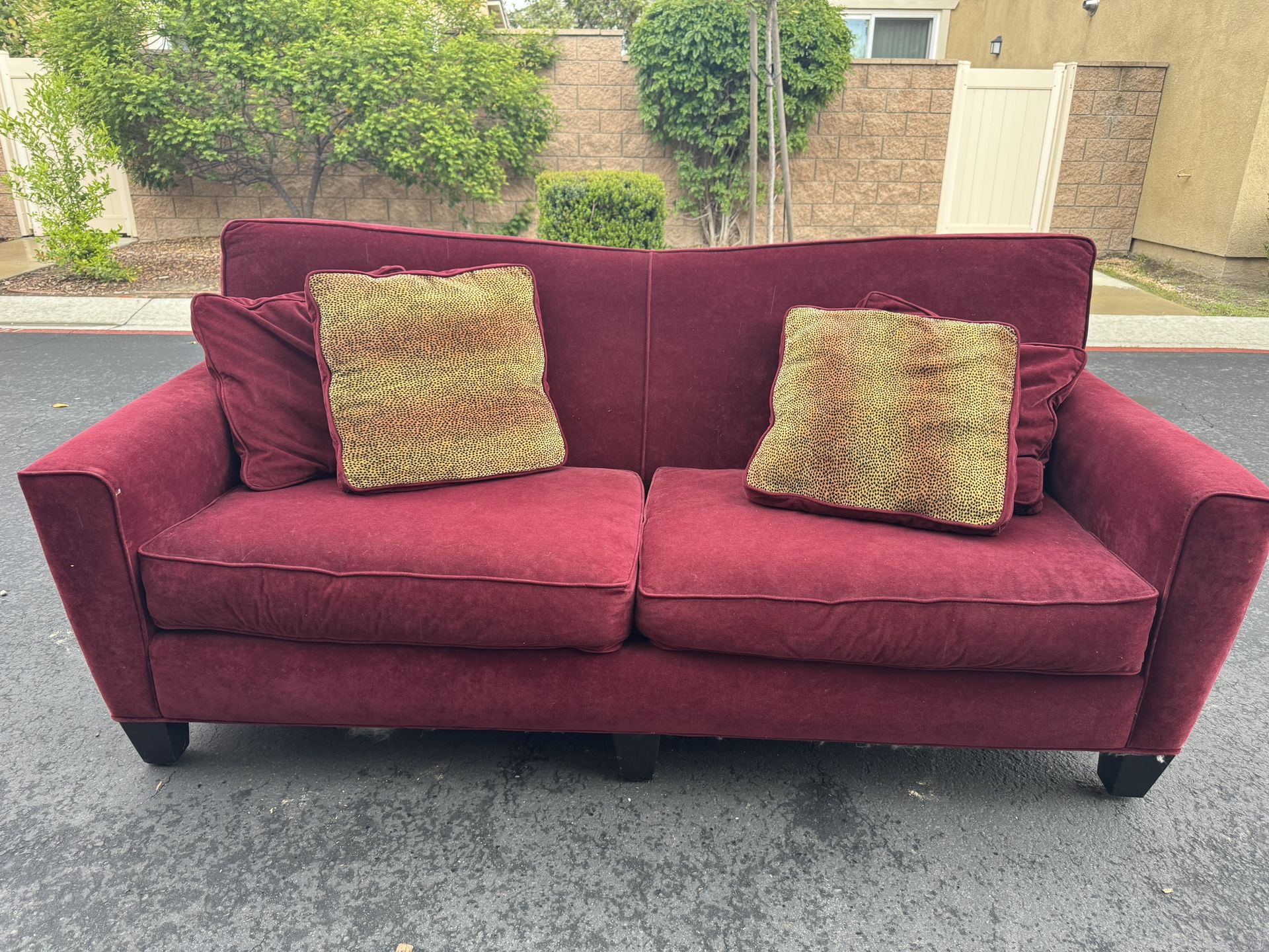 Red Couch With Four Pillows 