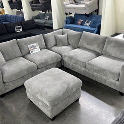 BRAND NEW GRAY CORDUROY SECTIONAL WITH OTTOMAN