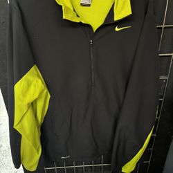 Nike Dri-FIT men's gray and neon green quarter-zip pullover jacket. 