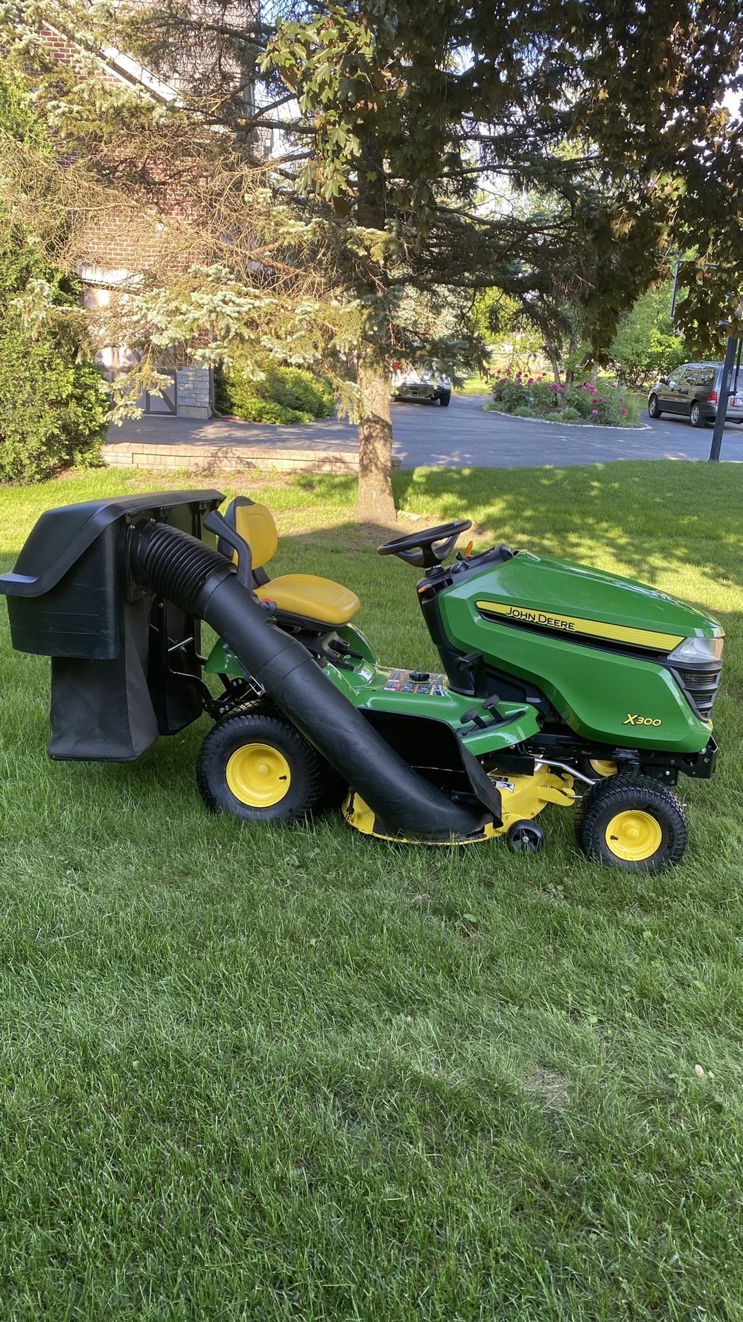 John Deere , riding mower X300 , 42” deck , 100 hours, bagger system
