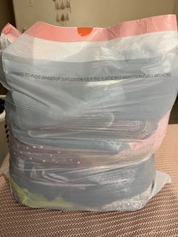 Bag of women’s clothes, sizes small and medium.