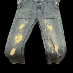 Distressed denim overalls