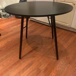 $60 black round table -(target brand)