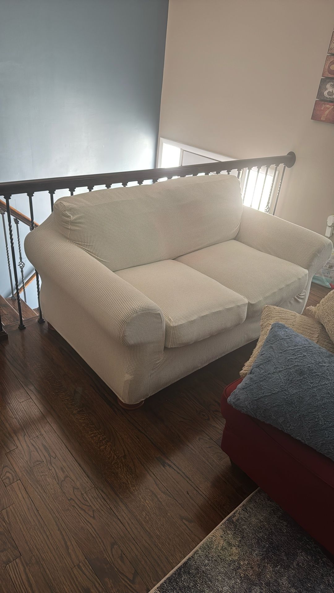 Couch With A White Cover .