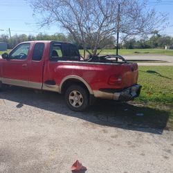 99F150 extra cab.Step side fiberglass bed