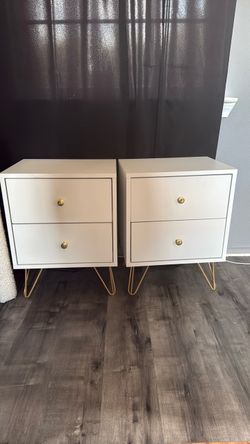 2 white and gold night stands