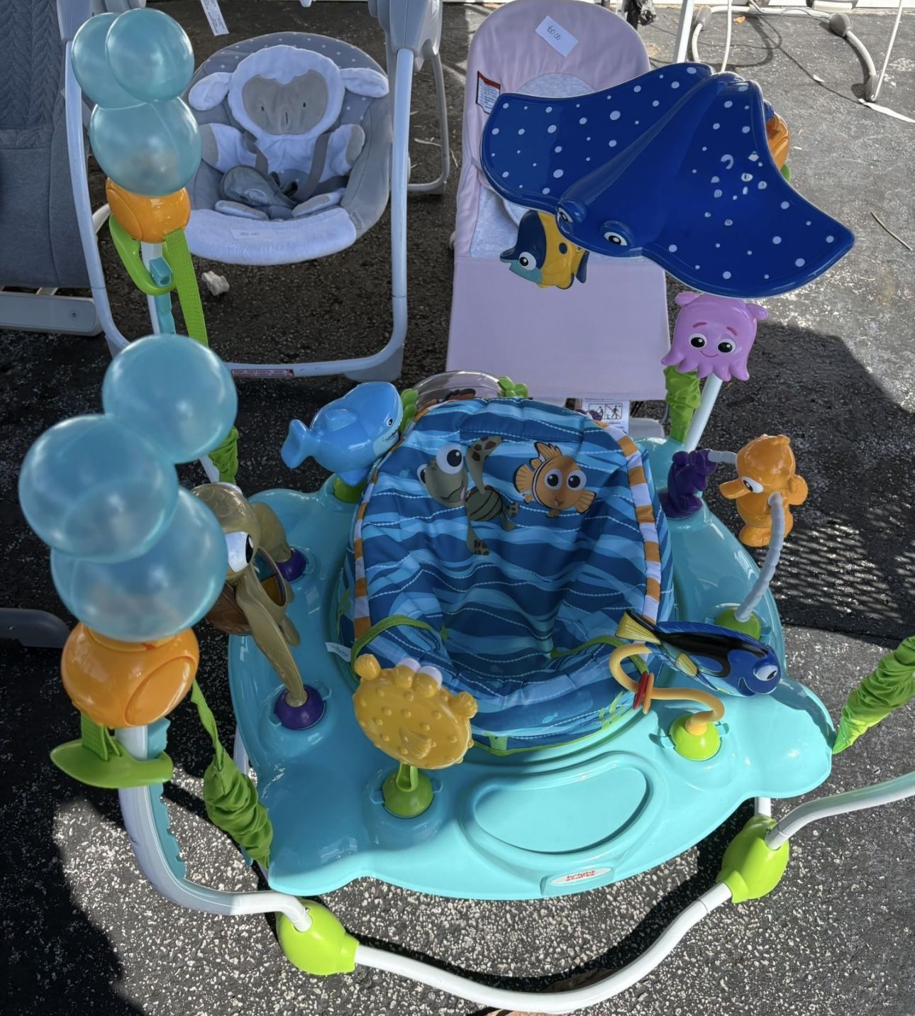 Bright Starts Disney Baby Finding Nemo Sea of Activities Baby Activity Center Jumper with Interactive Toys, Lights, Songs & Sounds