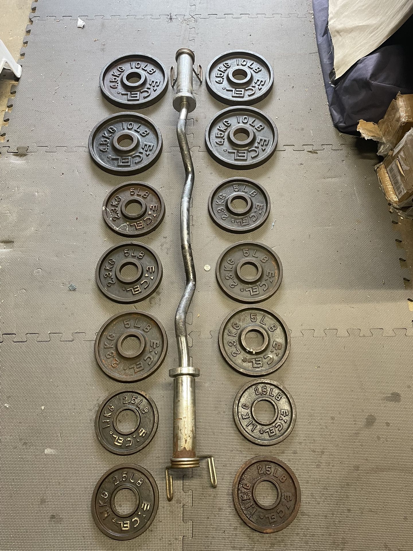 Olympic Weight Plates / Curl Bar. 90 Dollars