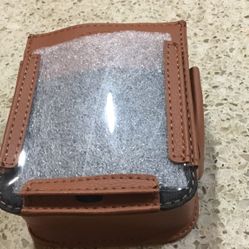 Cell Phone Car Holder For Use While Driving. Has Vinyl Pouch To Hold Phone. Two Side Places To Hold Pens. Compartment Behind Cell Phone Holder