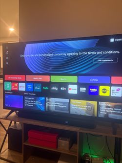 65 Inch LG 4K TV barely used plus sound bar