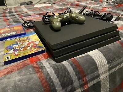 PS4 console With 2 Controllers And 3 Games.