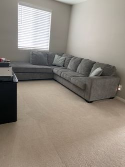 Medium sectional couch with pullout bed and pad.