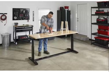 BRAND NEW WORK TABLE.WITH ADJUSTABLE HEIGHT
