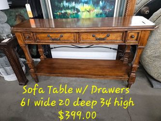 Sofa table 2 drws We are located at 2811 East Bell road. Another Time Around Furniture.