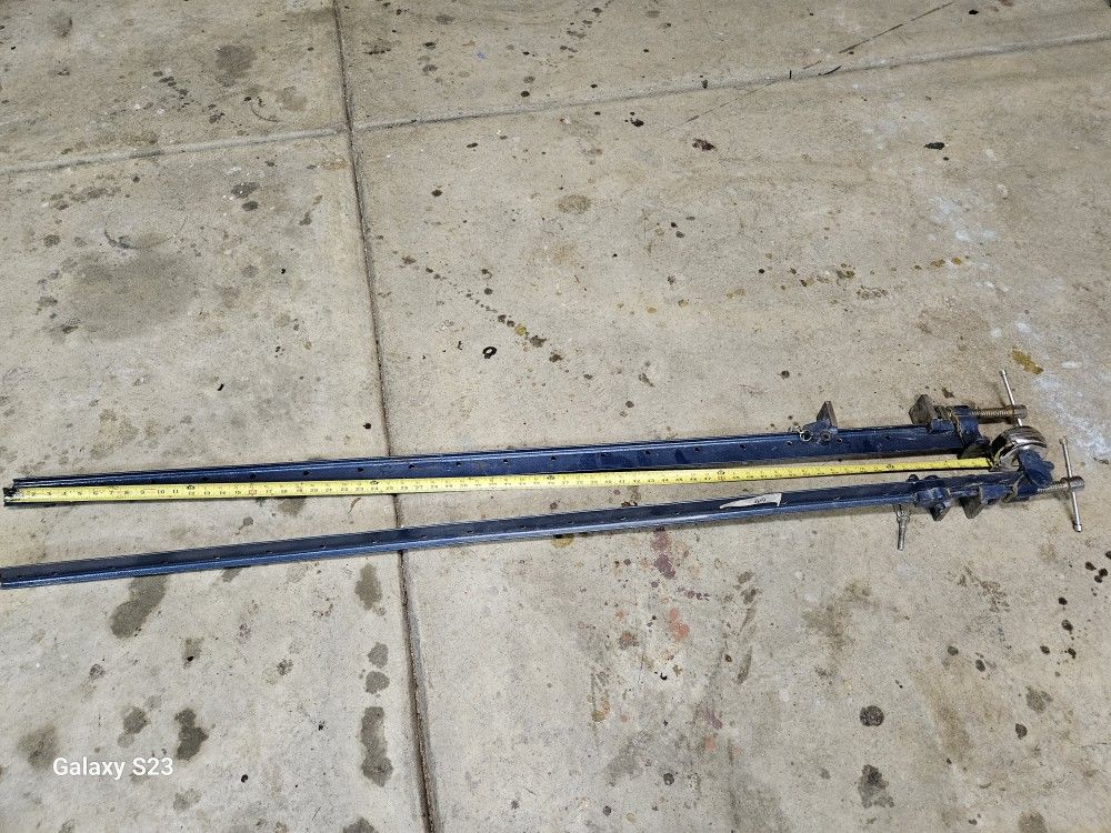 Metal Clamps. Approximately 66 Inches Long