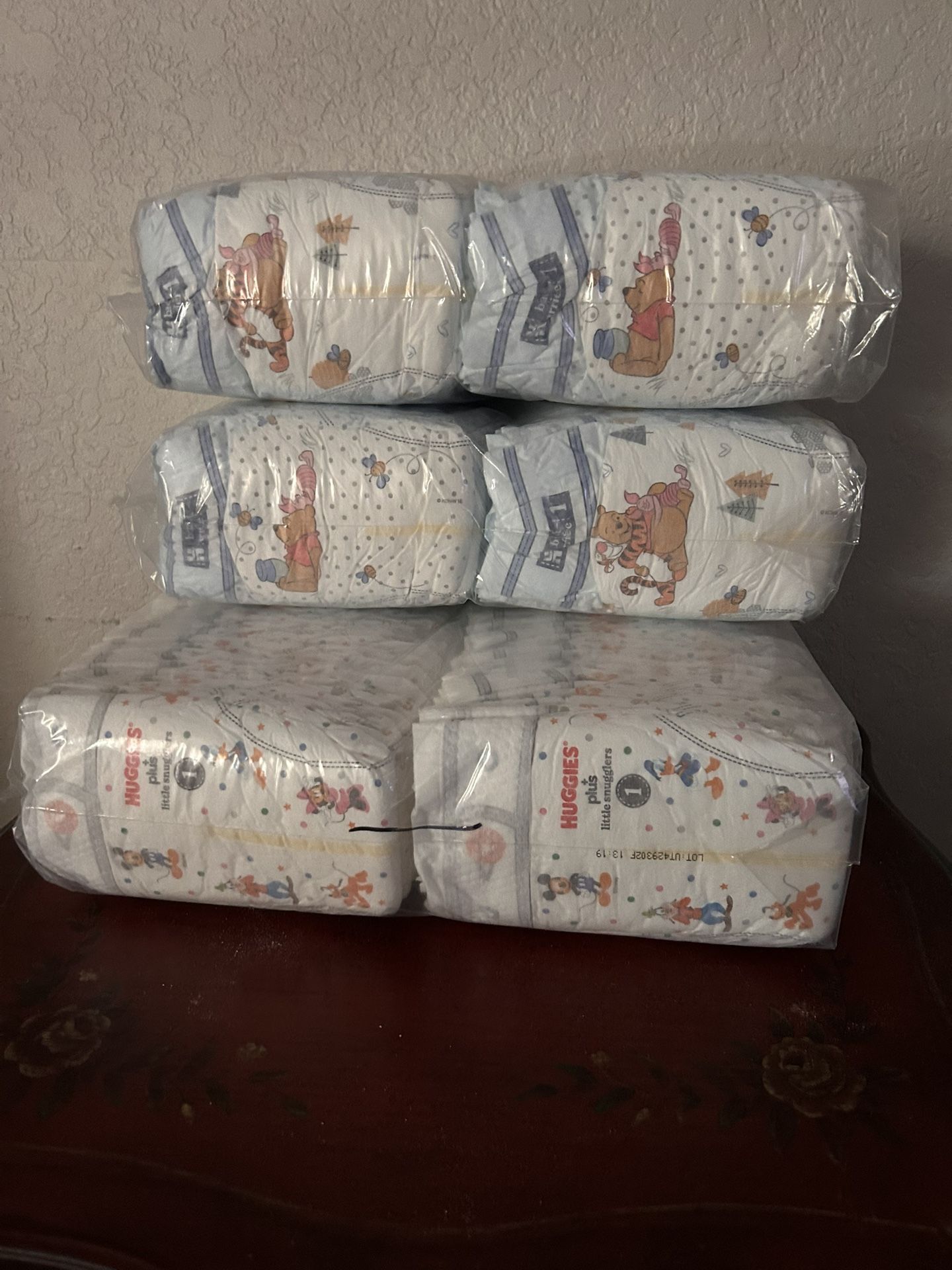 3 1/2 bags of huggies diapers size 1 + 1 pampers size 1
