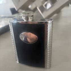 8oz black Flask leather & silver faux  … $25 (Has faint monogrammed letters on it)