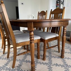 Elegant Solid Wood Dining Table with Carved Legs & Chair Detail