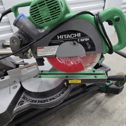 Chop Saw  HITACHI C1OFSH
10" SLIDE COMPOUND MITER SAW , With Laser,  Stand  and New Blade 