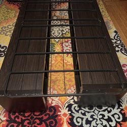 Twin bed frame with cubbies as base