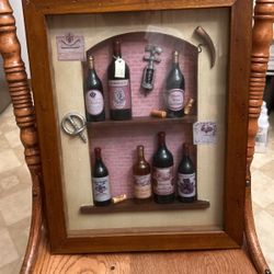 13”x16””glass frame With Small bottles, corkscrew, great for mower and rec room area