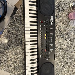 RockJam 49 Key Keyboard Piano with Power Supply, Sheet Music Stand, Piano Note Stickers & Simply Piano Lessons, Black