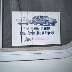 Trail Manor pop-up travel trailer.