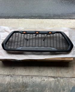2016-2023 Toyota Tacoma Grille W/ LED Turn Signal Light & DRL Matte Black OEM