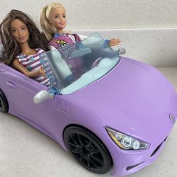purple barbie car and 2 barbie dolls
