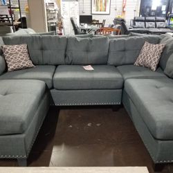 Gray sectional with pinheads