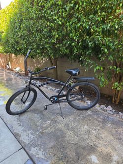 Phat Cycles single-speed 26-inch classic beach cruiser, wide handlebars, plush seat, fat balloon tires and back rack. Including, battery operated ligh