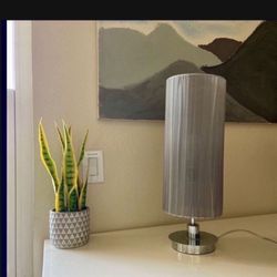 One Grey Cylindrical Table Lamp With Stainless Steel Base