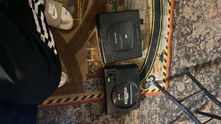 Saga Saturn And Sega Genesis With Controllers 