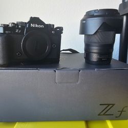 Nikon Zf  mirrorless camera with 24-70mm lens and camera bag