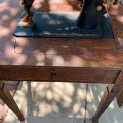 Old Sewing Machine Attached To Table