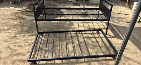 Twin bed frame with slide out bed under