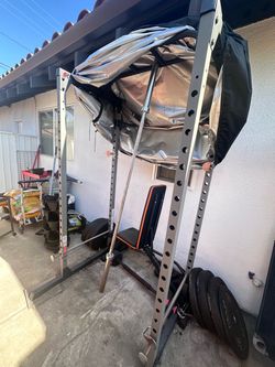 Squat rack cage with equipment
